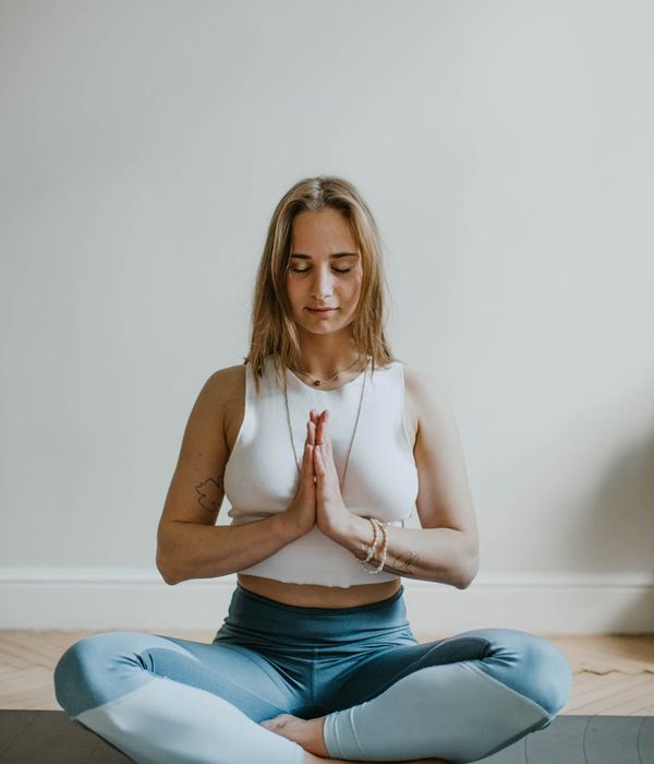 A serene person practicing mindful breathing in a calm environment.